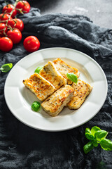 fried halloumi cheese with basil healthy meal food snack on the table copy space food background rustic top view keto or paleo diet veggie vegan or vegetarian food