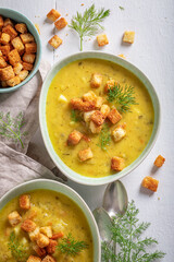 Sour gherkins soup served with cream and croutons.