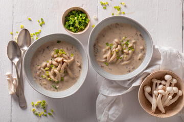 Creamy mushroom shimeji soup with chives and cream.