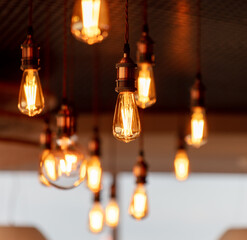 Decorative antique edison style filament light bulbs hanging from ceiling