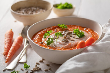 Creamy carrot soup as a seasonal dish.