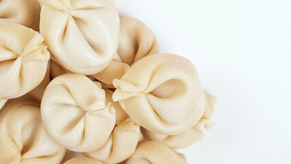  Dumplings on white background closeup. Uncooked dumplings. Top view.