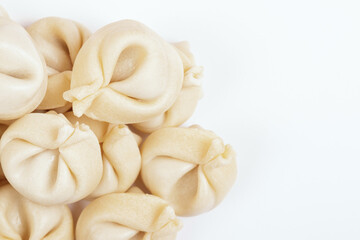 Fototapeta na wymiar Dumplings on white background closeup. Uncooked dumplings. Top view.