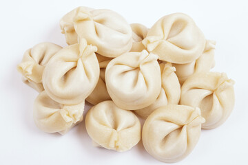  Dumplings on white background closeup. Uncooked dumplings. Top view.