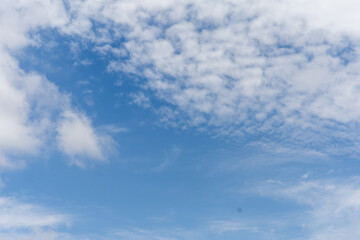 Fototapeta premium Clear blue sky with white clouds in summer in Thailand. 