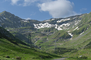 Fototapeta na wymiar View of Transfăgărășan (trans + Făgăraș) or DN7C view. Transfagarasan road - Ceaușescu's Folly in Carpathian Mountains in Romania. The Transfăgărășan.