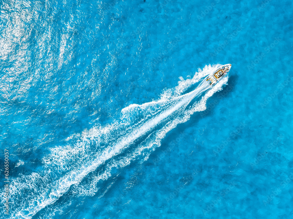 Wall mural vacation and leisure. aerial view on fast boat on blue mediterranean sea at sunny day. fast ship on 