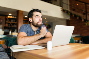 Pensive smart man thinking about her freelance work