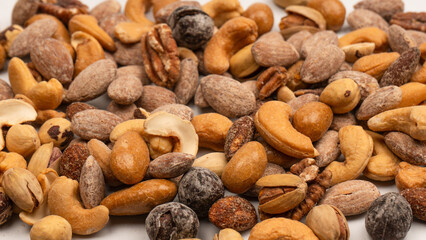 A group of almonds, pistachios, walnuts, macadamia, cashews.