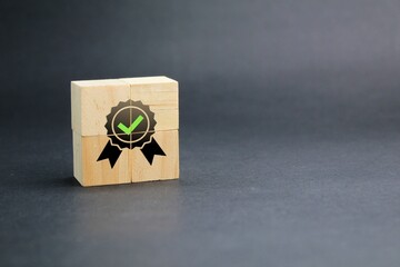 wooden cube with verified icon or sign. certified concept. Quality warranty concept.  product and...