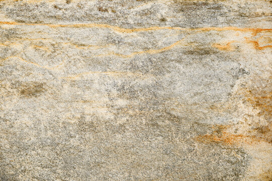 Stone background texture. Old aged beige stone wall or floor, rock pattern