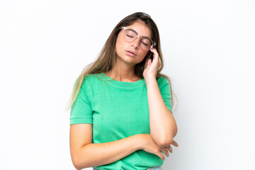 Young caucasian woman isolated on white background with headache