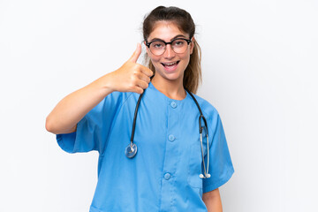 Young nurse doctor woman isolated on white background with thumbs up because something good has happened