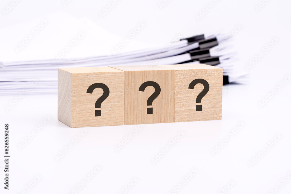 Aufkleber three wooden cube with question marks on white background