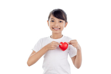 Asian Little girl holding red heart in her hands isolated on white background with clipping path.