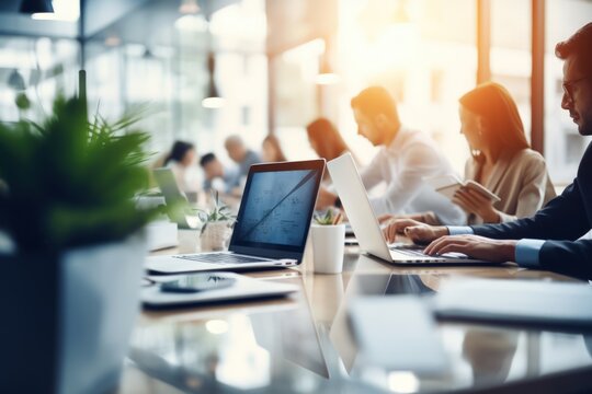 Blurred Office Interior Space Background With People Working And Meeting On Table. Business Concept. 