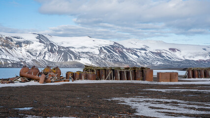 Abandoned norwegian whale hunter station rusty blubber tanks