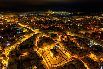 Aerial view of a town at night lit with city lights