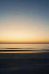 Sunrise at the sea with high motion blur. Natural colors at the beach
