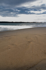 Beautiful bay with a lonely beach. Vertical photography.