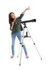 Young Asian woman with telescope pointing at something on white background © Pixel-Shot