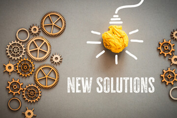 New solutions, Small precise gear mechanisms, a ball of paper imitating a glowing light bulb, text...