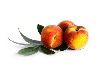 Sweet peaches and leaves on white background