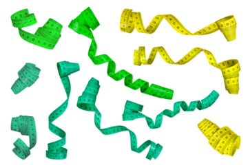 Measuring tape isolated on white background. A large set of measuring tapes of different colors rolled into a spiral. Ribbons of green and yellow in centimeters on a white background.