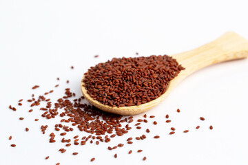 Garden cress seeds (Lepidium sativum L.) in wooden spoon isolated on white background.