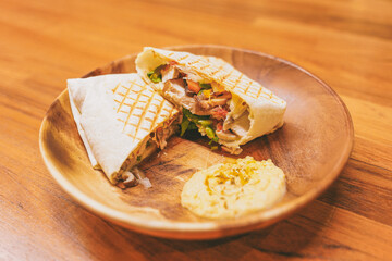 Rosemary chicken wrapaninis on wooden plate