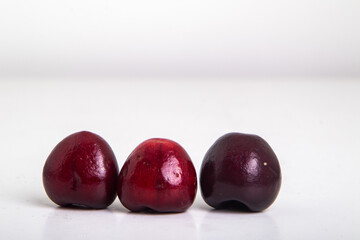 several cherries on a white background, isolated