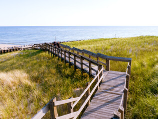 Boardwalk over sand dunes in Muskegon, Michigan, USA, Summer 2023 with Lake Michigan in the background