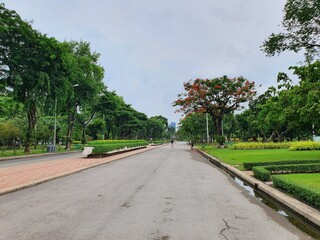 BANGKOK, THAILAND. JUIY 10, 2023: The atmosphere vibes of activities which people like to spend the weekend at the Lumphini park of Bangkok, such as running, walking, exercising, riding.
