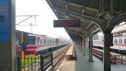 A deserted train platform. The commuter line train stop at the station. Mass public transportation in Jakarta.
