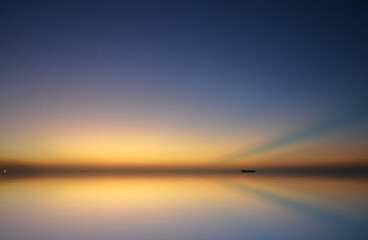 a beautiful reflection of a sunset in the caribbean sea