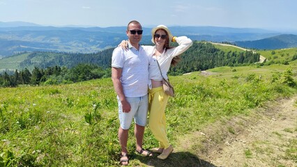 couple in love on a background of mountains in summer. Carpathians Ukraine