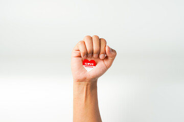hand holding ribbon, red and white flag of Indonesia independence day August 17th, i love indonesia, isolated on white background.