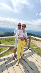 Fototapeta na wymiar couple in love on a background of mountains in summer. Carpathians Ukraine