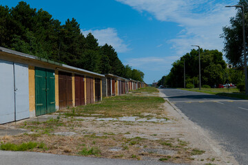 a row of colorful garages