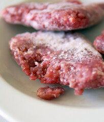 freshly taken out of the deep freezer frozen ground beef, frozen meat,
