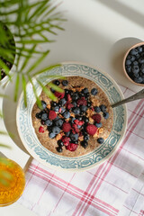 Healthy vitamin-rich balanced vegan breakfast. Raw flaxseed porridge with walnuts, berries, rosehip tea, scrambled eggs with vegetables. Useful homemade veggie lunch. Vitamins, minerals. Gluten free.