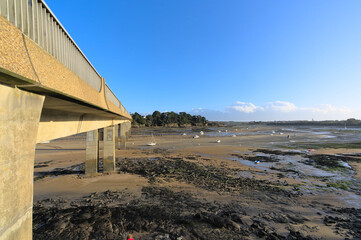 Fototapeta na wymiar View of the bay of Lancieux during low tide a sunny winter afternoon (Brittany, France). 