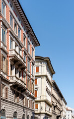 Fototapeta na wymiar Buildings and street of Borgo Teresiano, an elegant district built in the 18th century at the behest of Maria Theresa of Austria, Trieste city center, Italy