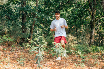 young man running outdoors cross country