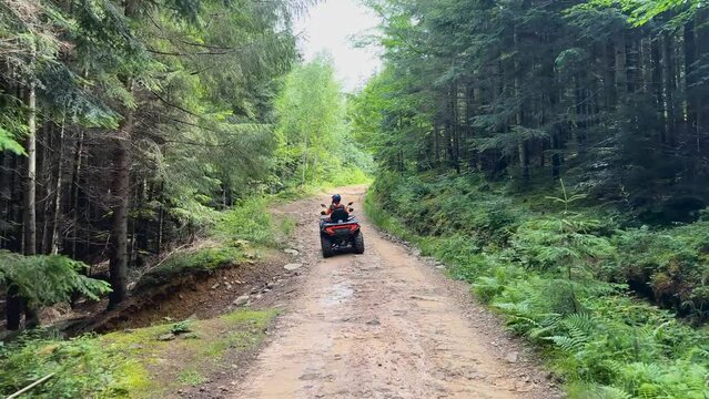 Riding a quad bike in the mountains active extreme recovery