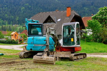 Mini excavator at the construction site. Compact construction equipment for earthworks. An indispensable assistant for earthworks