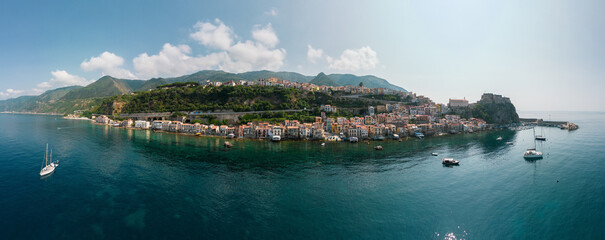Italy, July 2023: aerial super panorama of the beautiful medieval village of Scilla and Chianalea...