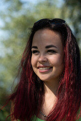 Close-up portrait of a girl in a city park in summer