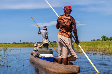 On the road in a dugout canoe through the Okavango Delta, Botswana