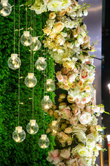 beautiful Wedding party decoration with flowers, lights, curtains, table, sofa, walkway etc.